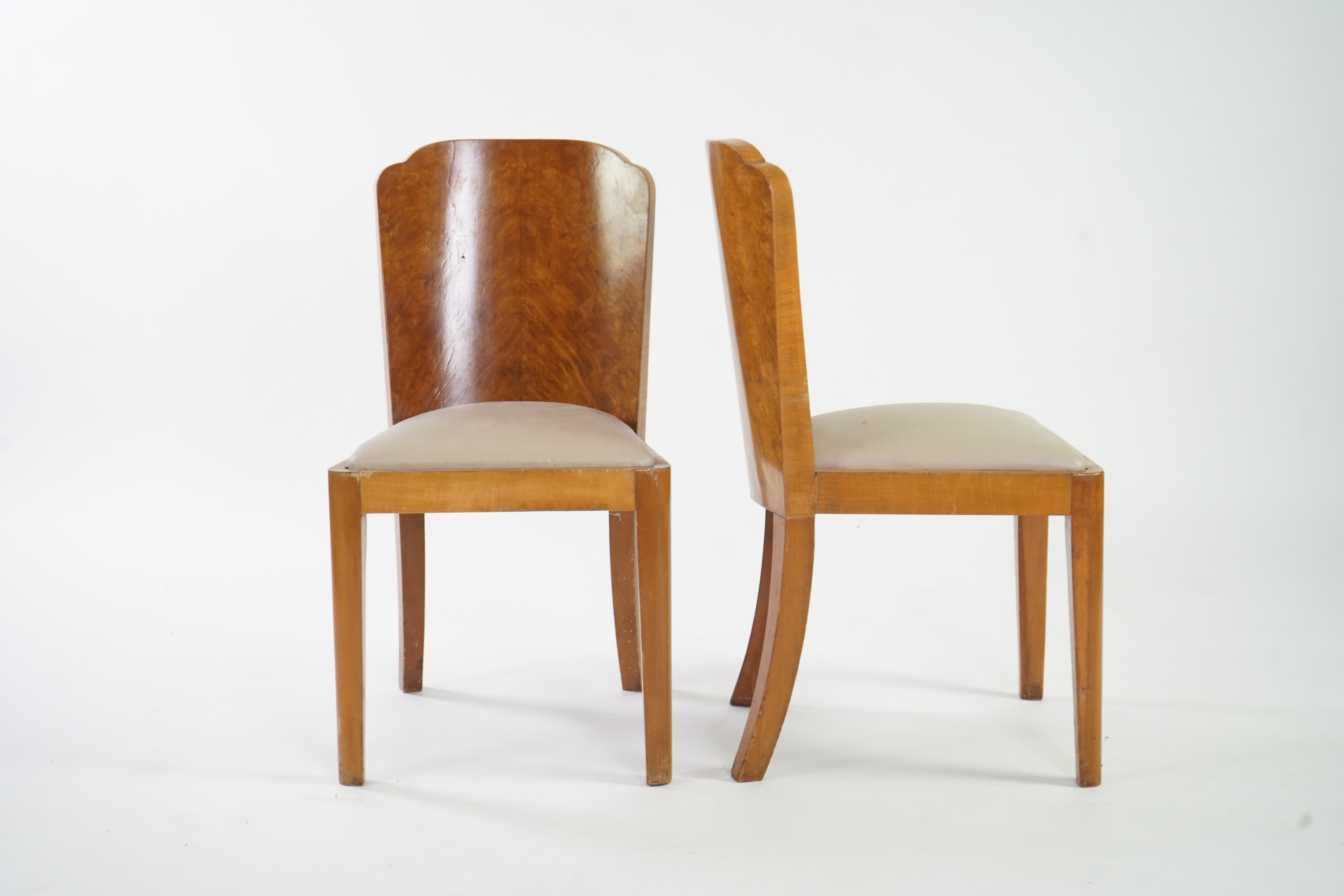 Attributed to Harry and Lou Epstein: An Art Deco burr walnut dining suite